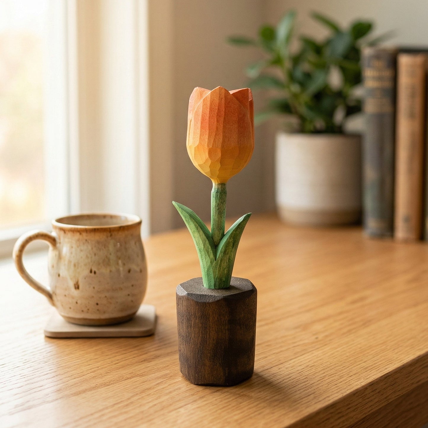 Wooden tulip sculpture on a wooden surface with a mug and books in the background.